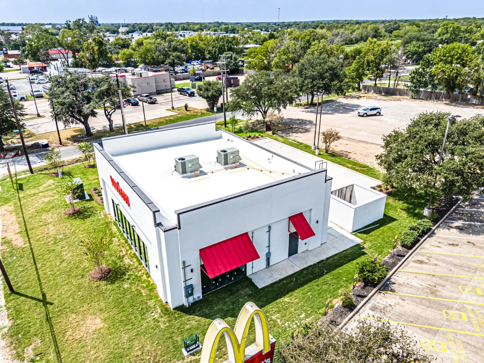 Aerial view of the completed Verizon Bryan store and its parking area