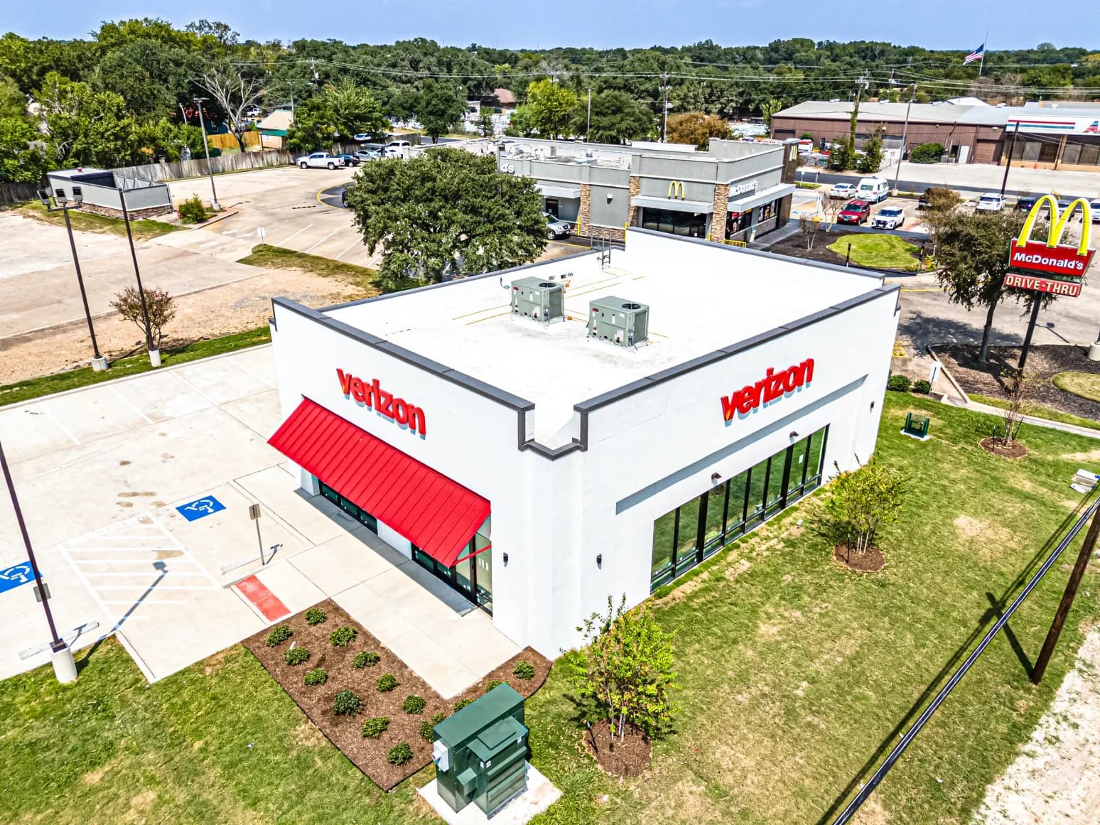 Aerial view of the Verizon Bryan site within the surrounding retail corridor